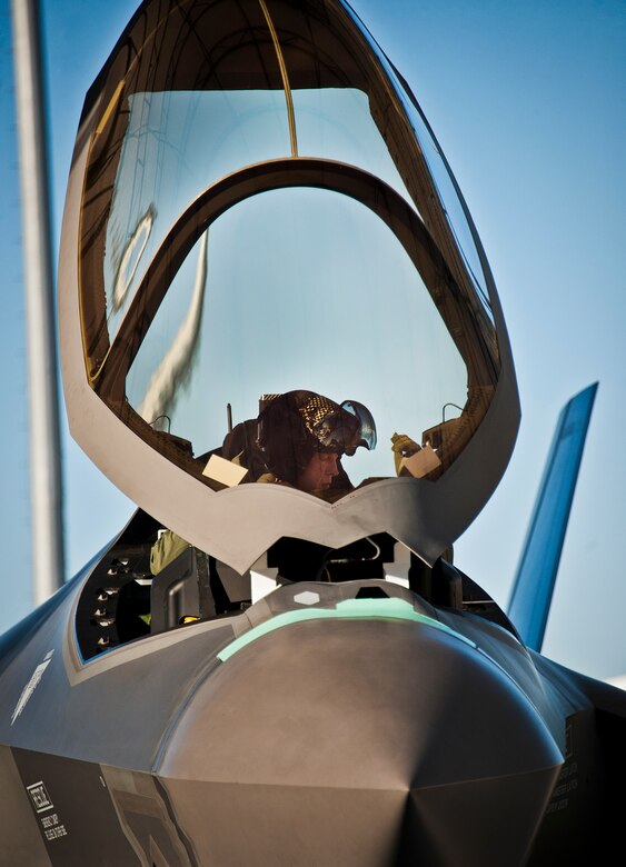 Maj. Laurens Vijge, a Royal Netherlands Air Force pilot, makes adjustments while in the seat of an F-35A Lightning II prior to his first flight in the aircraft Dec. 18 at Eglin Air Force Base, Fla.  Vijge became the first RNLAF pilot to fly the joint strike fighter and the flight marks the first sortie for the RNLAF here.  (U.S. Air Force photo/Samuel King Jr.)