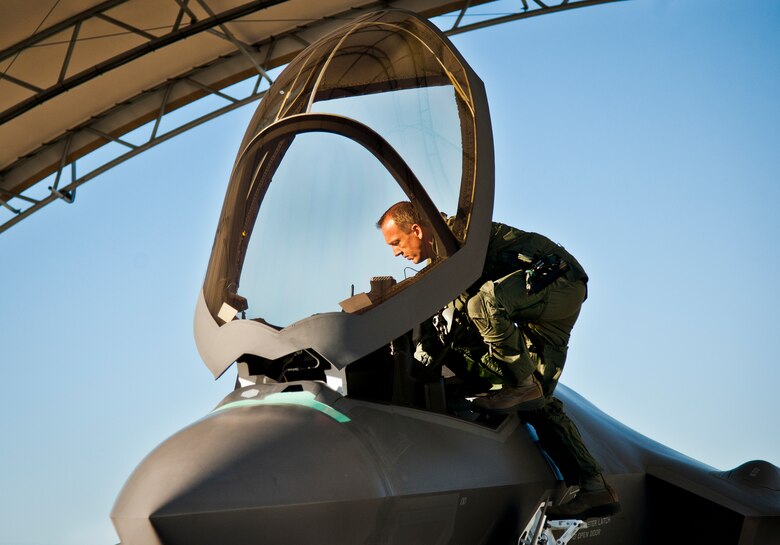 Maj. Laurens Vijge, a Royal Netherlands Air Force pilot, climbs into the seat of an F-35A Lightning II for his first flight in the aircraft Dec. 18 at Eglin Air Force Base, Fla.  Vijge became the first RNLAF pilot to fly the joint strike fighter and the flight marks the first sortie for the RNLAF here.  (U.S. Air Force photo/Samuel King Jr.)