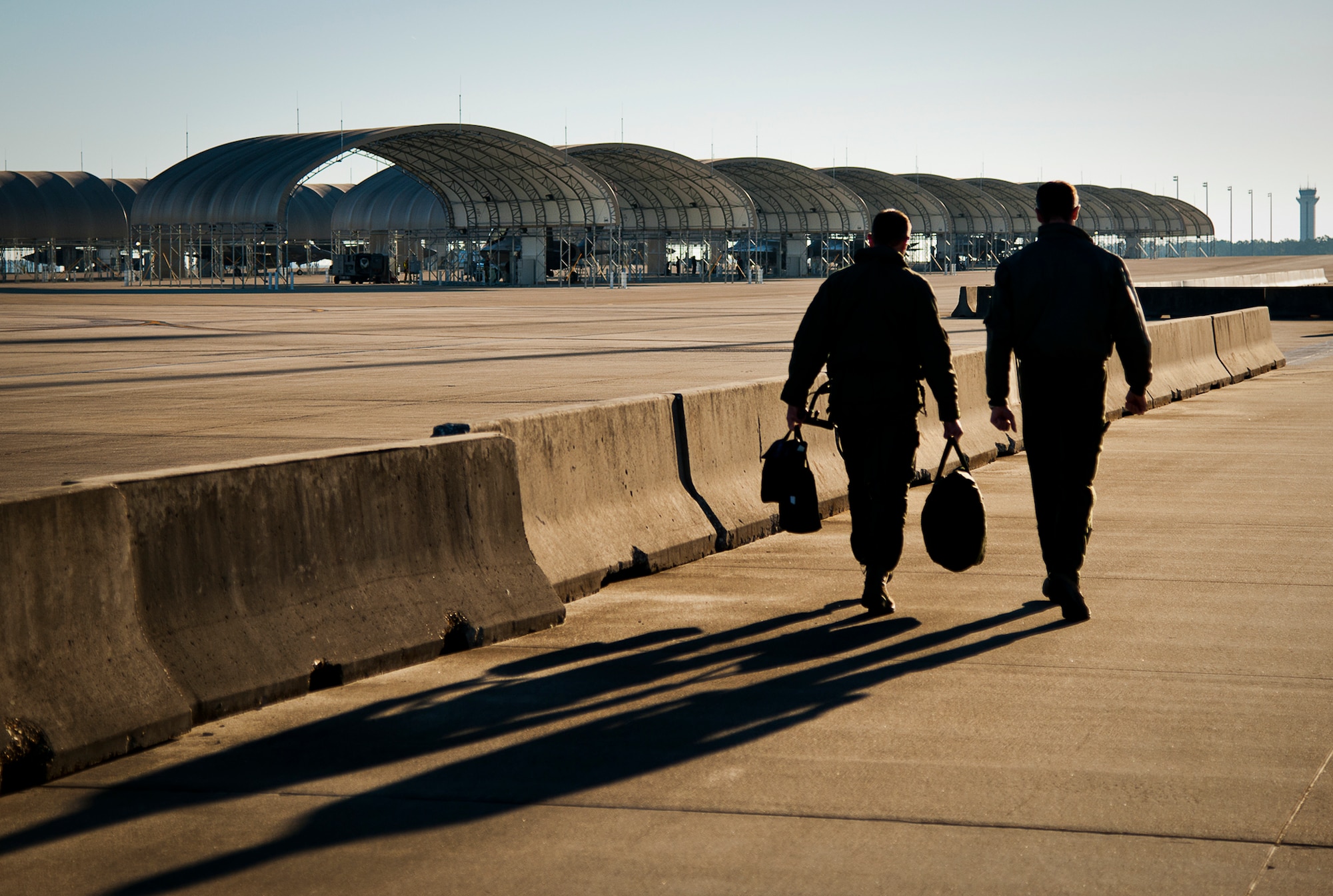 Maj. Laurens Vijge and Lt. Col. Albert De Smit, of the Royal Netherlands Air Force, walk out to the F-35A Lightning II prior to Vilge’s first flight in the aircraft Dec. 18 at Eglin Air Force Base, Fla.  Vijge became the first RNLAF pilot to fly the joint strike fighter and the flight marks the first sortie for the RNLAF here.  (U.S. Air Force photo/Samuel King Jr.)