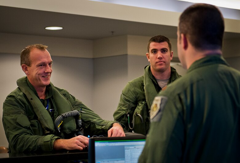 Maj. Laurens Vijge, a Royal Netherlands Air Force pilot, and Lt. Col. Matt Renbarger, the 58th Fighter Squadron commander, receive their preflight briefing Dec. 18 at Eglin Air Force Base, Fla.  Vijge became the first RNLAF pilot to fly the F-35A Lightning II and marks the first flight for RNLAF here.  (U.S. Air Force photo/Samuel King Jr.)