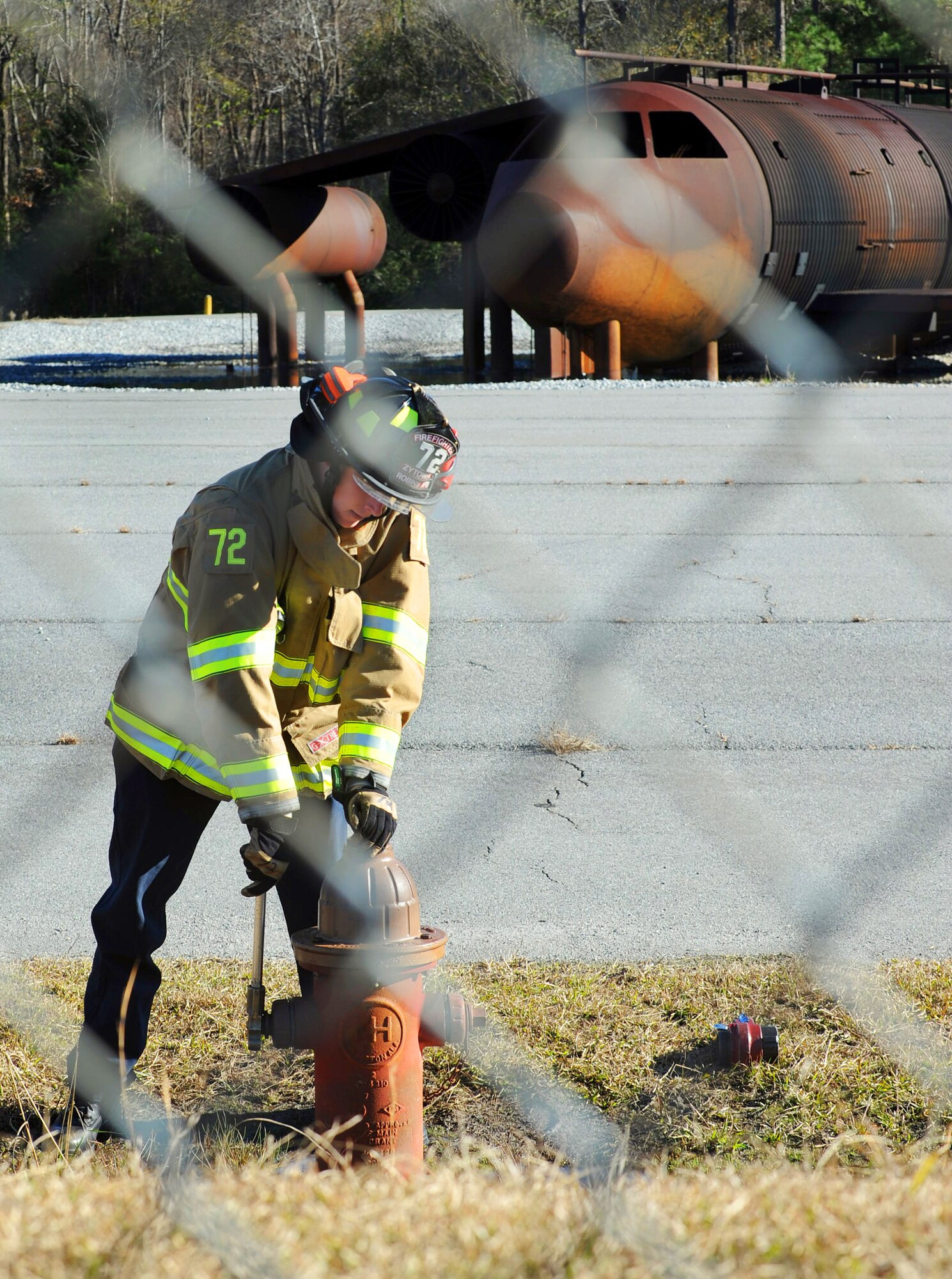 Daniel Zytowski, a Robins Air Force base firefighter, opens a fire hydrant in preparation for a joint training session between Macon-Bibb County and Robins Fire Departments Wednesday. A total of 22 firefighters participated in the training which both departments view as beneficial to their common mission of fighting fires and saving lives. (U.S. Air Force photo by Tommie Horton)
