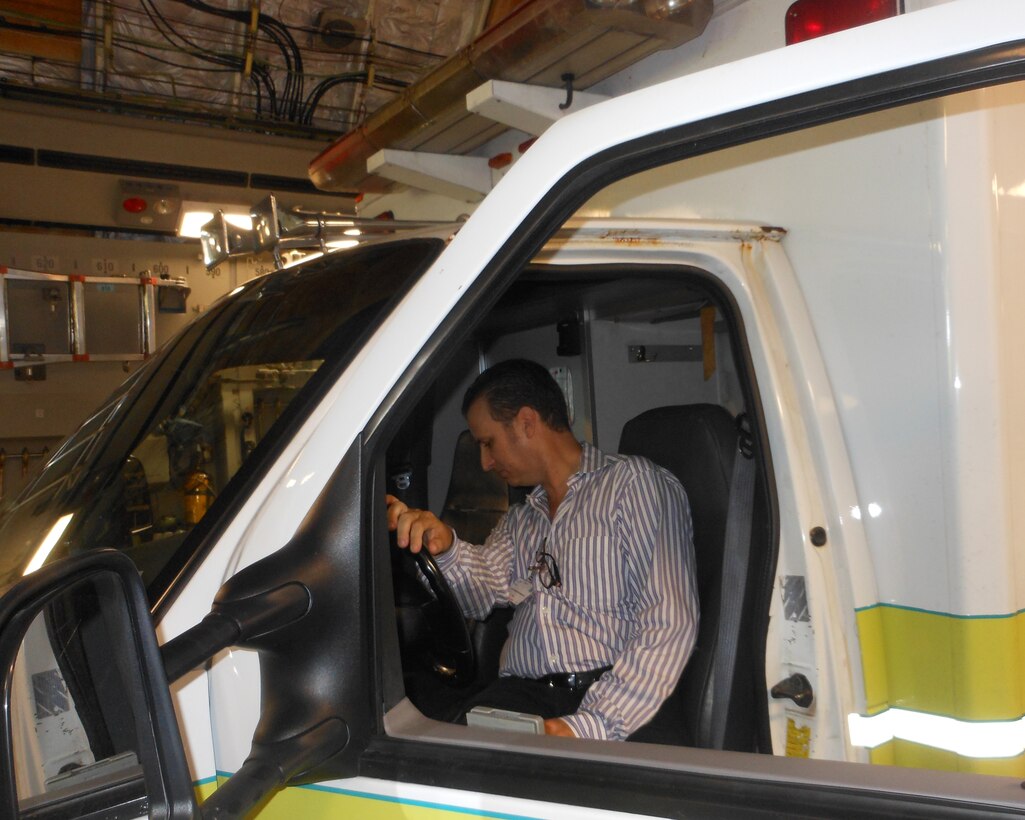 A Dominican official inspects the ambulance donated as part of the Denton Humanitarian cargo transported on a C-17 on May 29, 2013. (Photo by Willie Jackson)