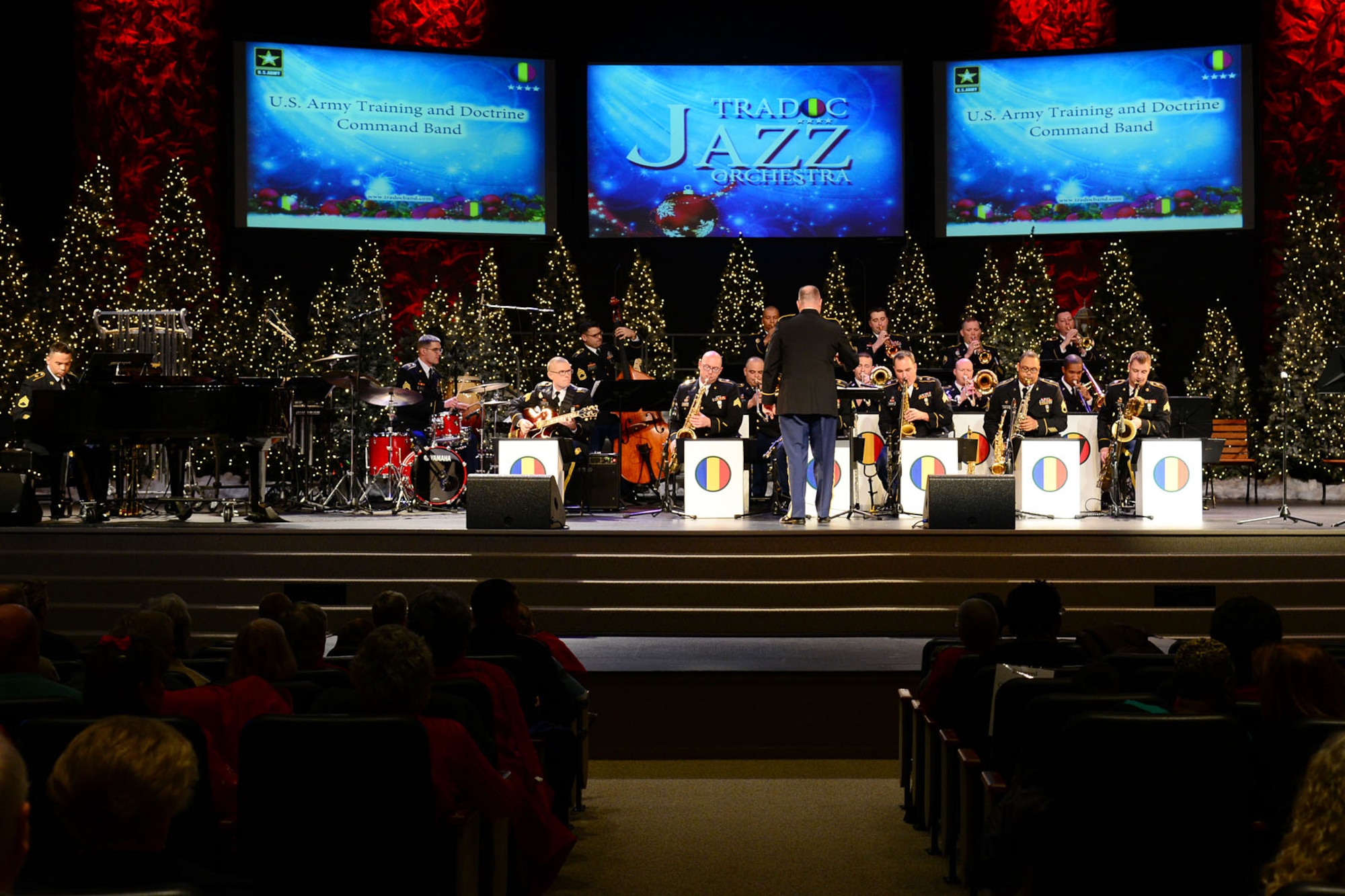 U.S. Army Spc. Anna Leverenz, Army Training and Doctrine Command Band musician, sings “Let it Snow” during the band’s concert rehearsal at Fort Eustis, Va., Dec. 9, 2013. Days before the concert, the group ran through the entire performance to work on transitions between the songs and familiarize themselves with the overall flow of the presentation. (U.S. Air Force photo by Staff Sgt. Ashley Hawkins/Released)