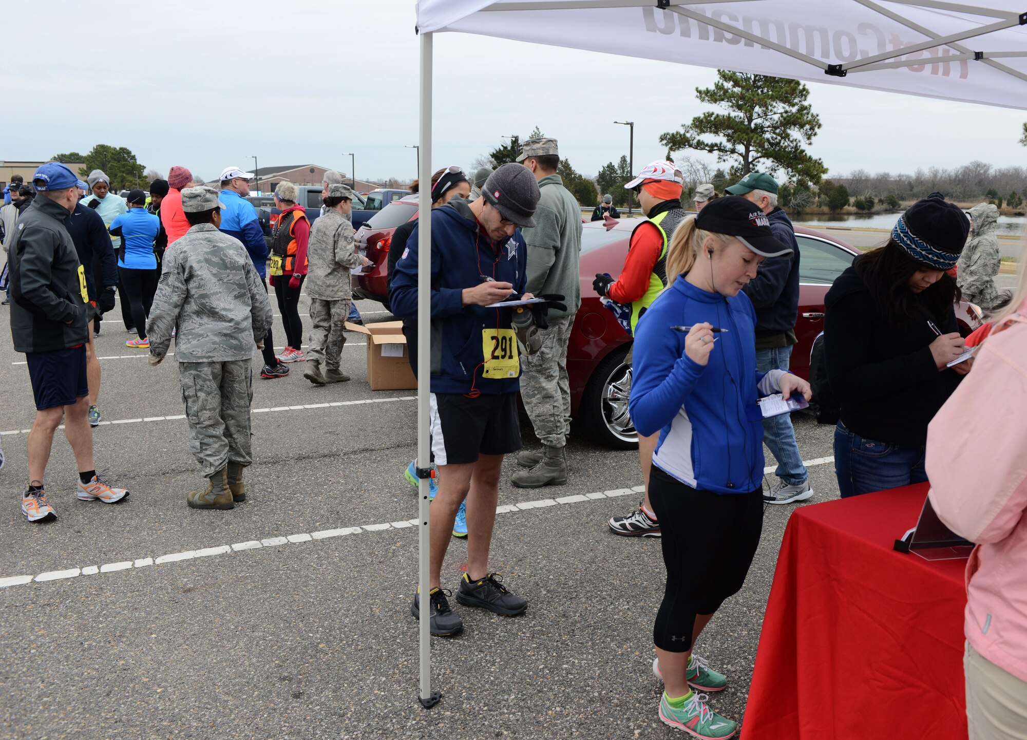 Participants register for the 4th annual “Race ‘Round the Base” at Langley Air Force Base, Va., Dec. 14, 2013. The 10-mile event, sponsored by the Peninsula Track Club, was open to both Service members and members of the local community. (U.S. Air Force photo by Senior Airman Connor Estes/Released)
