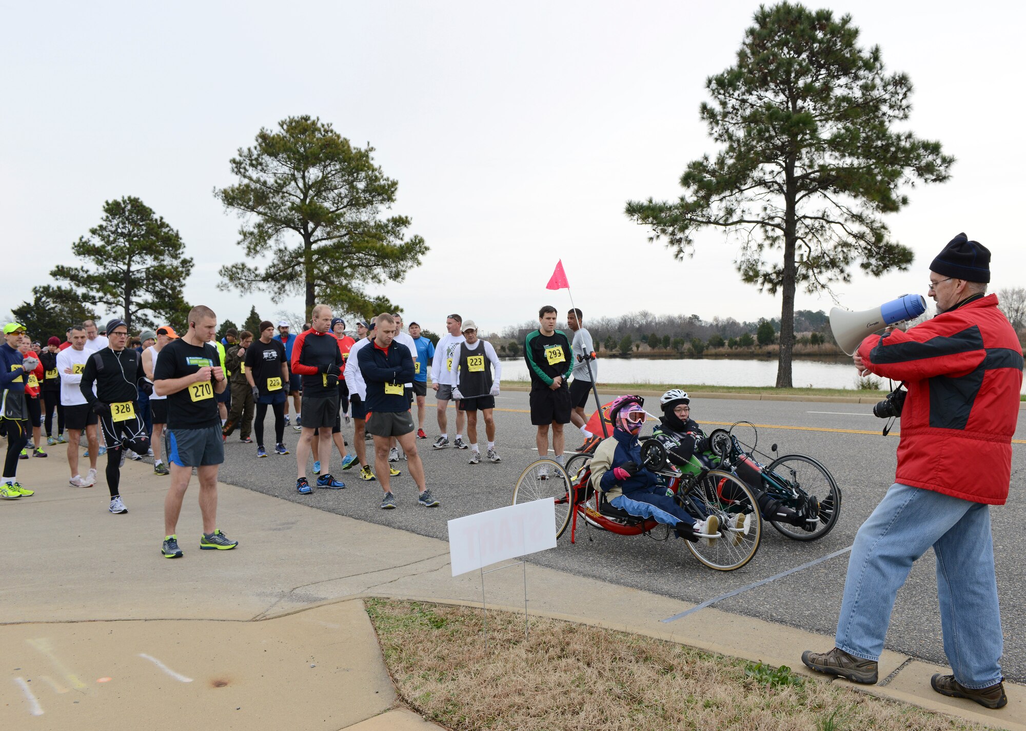 Bruce Davis, Peninsula Track Club coordinator, prepares participants for the 4th annual “Race ‘Round the Base” at Langley Air Force Base, Va., Dec. 14, 2013. The course took contestants on a 10-mile loop around various parts of Langley AFB. (U.S. Air Force photo by Senior Airman Connor Estes/Released)
