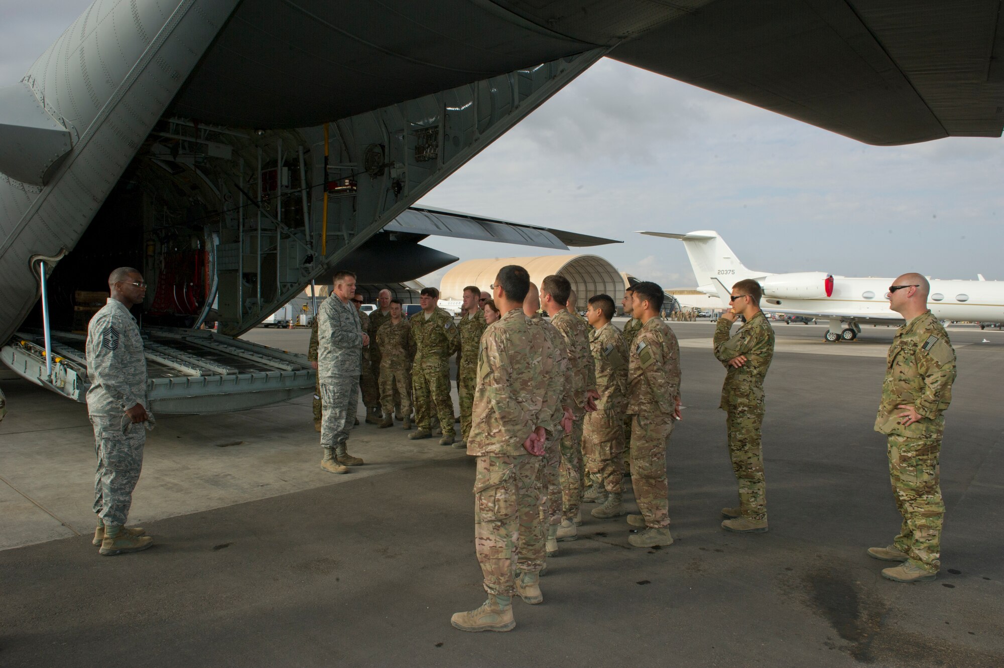 General Frank Gorenc, U.S. Air Forces in Europe and Air Forces Africa commander (right), and Chief Master Sgt. James Davis, USAFE-AFAFRICA command chief, speak with the maintainers of an HC-130P Combat King deployed to the 449th Air Expeditionary Group at Camp Lemonier, Djibouti, Dec. 14, 2013. The general and chief traveled to Africa to visit Airmen supporting the U.S. Africa Command mission and to address current issues affecting Airmen. (U.S. Air Force photo/Tech. Sgt. Benjamin Wilson)