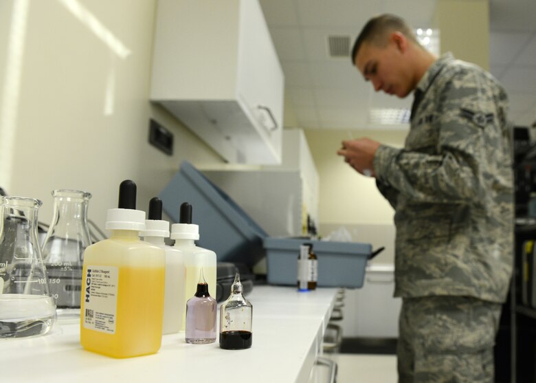 Airman 1st Class David Bednara, 31st Aerospace Medicine Squadron bioenvironmental engineering journeyman, prepares to test drinking water for minerals and unsafe chemicals, Dec. 17, 2013, at Aviano Air Base, Italy. The bioenvironmental engineering flight ensures Airmen’s safety by identifying workplace hazards to allow for the production of mandated policies in the interest of health and preventative medicine. (U.S. Air Force photo/Airman Ryan Conroy) 