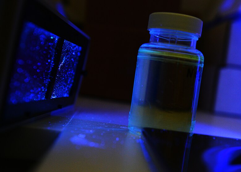 One aspect of 31st Aerospace Medicine Squadron bioenvironmental engineering is testing base-wide drinking water to ensure health standards are adhered to. Airmen place a sample of drinking water under a black light to check for chemicals and particles deemed hazardous to one’s health. (U.S. Air Force photo/Airman Ryan Conroy) 
