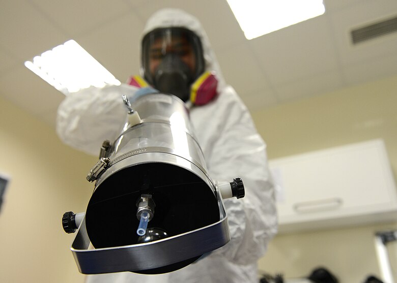 Staff Sgt. Paolo Melendez, 31st Aerospace Medicine Squadron bioenvironmental engineering radiation protection safety manager, tests air quality for unsafe chemicals during a training exercise, Dec. 17, 2013, at Aviano Air Base, Italy. When vulnerabilities are exposed through BEE assessments, commanders are notified and calculated solutions are proposed to ensure the welfare of Airmen. (U.S. Air Force photo/Airman Ryan Conroy) 