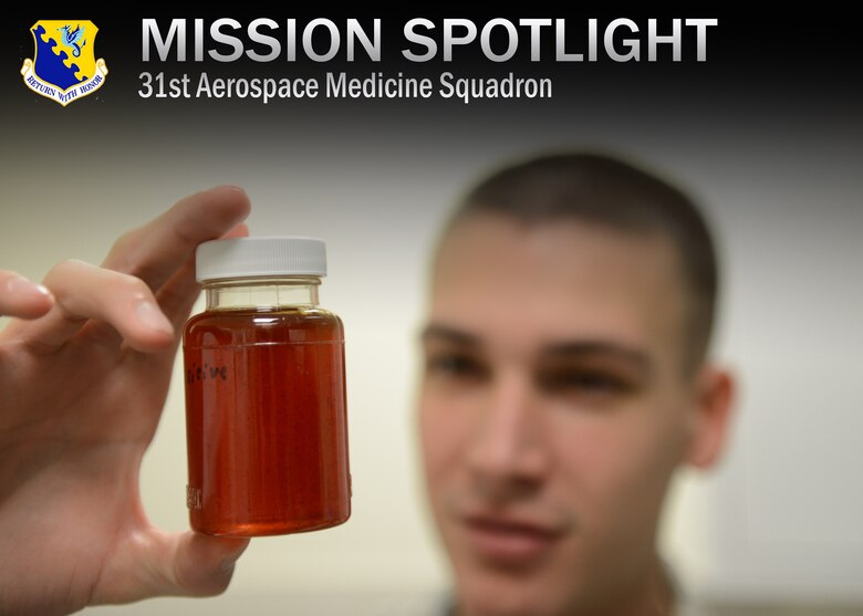 Airman 1st Class David Bednara, 31st Aerospace Medicine Squadron bioenvironmental engineering journeyman, inspects drinking water that tested positive for minerals and unsafe chemicals, Dec. 17, 2013, at Aviano Air Base, Italy. Also known as BEE, the flight ensures Airmen’s safety by identifying workplace hazards to allow for the production of mandated policies in the interest of health and preventative medicine. (U.S. Air Force photo/Airman Ryan Conroy) 