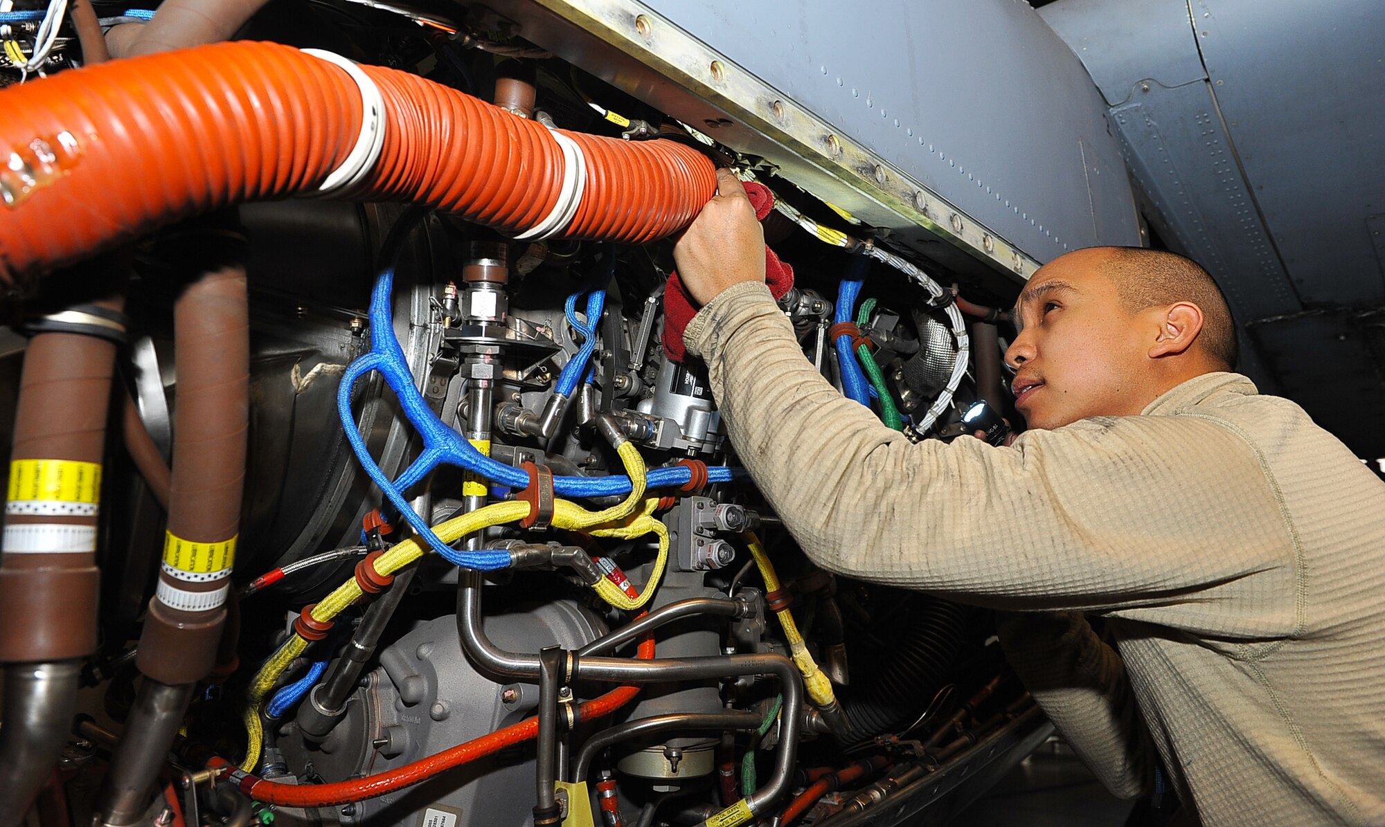 Senior Airman Jonathan Deguzman, 86th Maintenance Squadron aerospace systems technician, inspects a C-130J Super Hercules propeller engine, Dec. 11, 2013, Ramstein Air Base, Germany. Airmen with the 86th Aircraft Maintenance Squadron and 86th MXS work around the clock to ensure the readiness of the aircraft here. (U.S. Air Force photo/Airman Dymekre Allen)