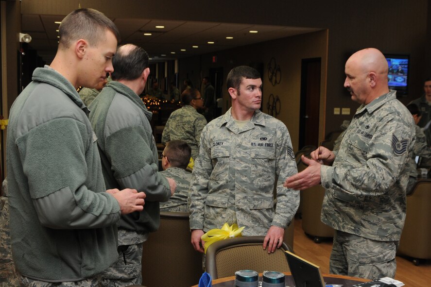 U.S. Air Force Tech. Sgt. Jim Graves, an aerospace maintenance craftsman with the 910th Maintenance Squadron, talks to fellow Reservists about the benefits of Yellow Ribbon Programs at the Yellow Ribbon event December 8, 2013 at the Community Activity Center, here. (U.S. Air Force photo/Tech. Sgt. James Brock)