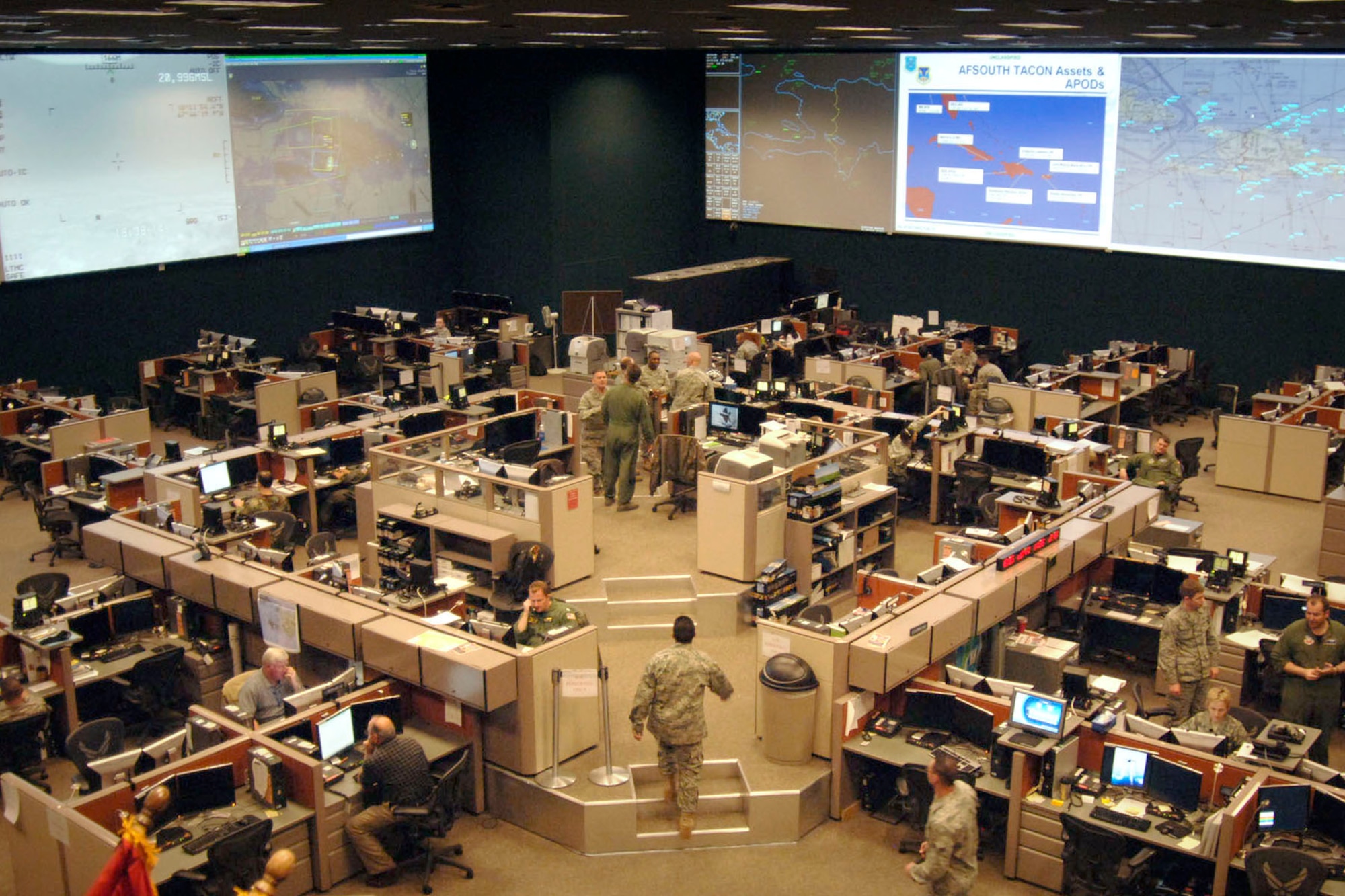 Personnel provide command and control information at the 612th Air and Space Operations Center, supporting Southern Command, in February 2010. Hanscom’s AOC Weapon System program office is working to improve the system’s current capabilities as the program moves into its engineering and manufacturing development phase. (U.S. Air Force photo/Master Sgt. Eric Petosky)
