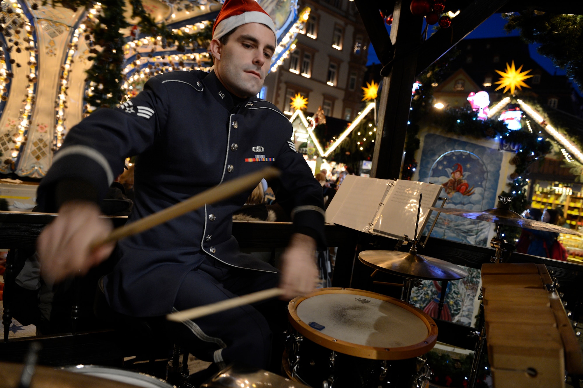 TRIER, Germany— U.S. Air Force Senior Airman Ed Zaryky, U.S. Air Forces in Europe Band’s Five Star Brass ensemble drummer from Trenton, N.J., performs holiday music at a Weihnachtsmarkt Dec. 17, 2013. The USAFE band’s free holiday concerts are one of the many ways they give back to the local community. (U.S. Air Force photo by Staff Sgt. Christopher Ruano/Released)