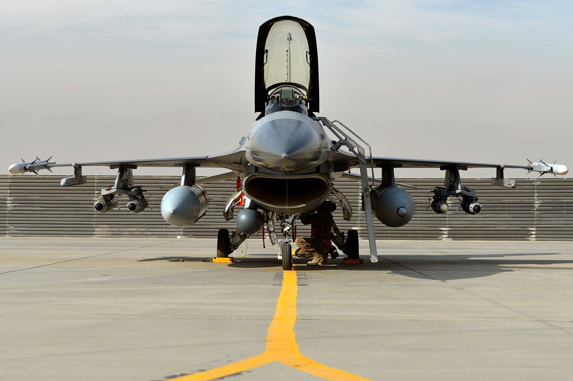 A newly arrived F-16 Fighting Falcon sits on the flightline at Bagram Airfield, Afghanistan, Dec. 15, 2013. The F-16s transitioned from Kandahar Airfield, Afghanistan, to Bagram once the main runway was renovated. (U.S. Air Force photo by Senior Airman Kayla Newman/Released)