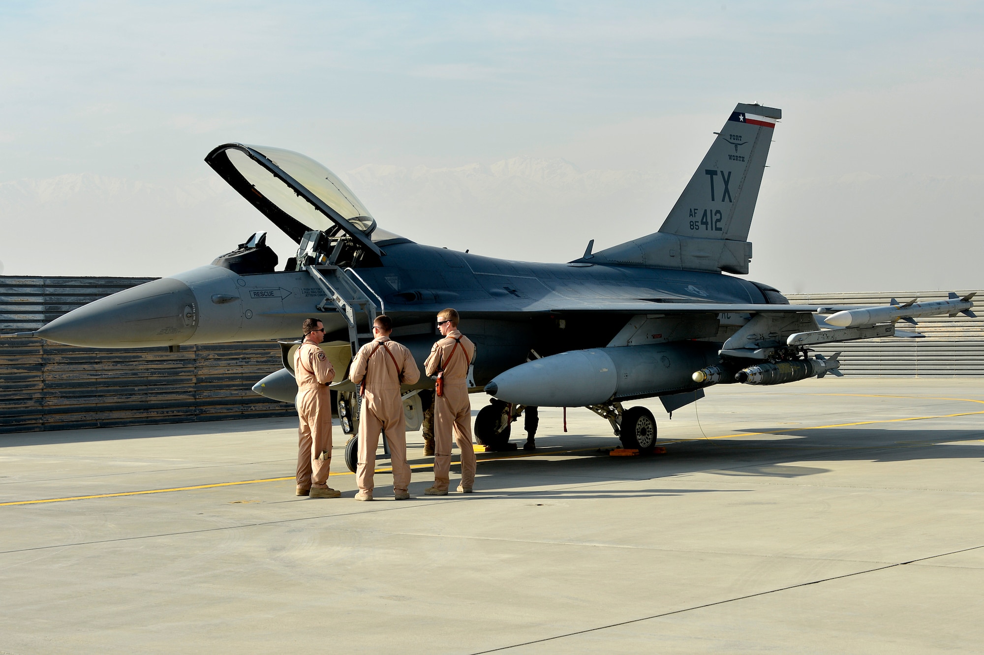 The first of several F-16 Fighting Falcons sits on the flightline at Bagram Airfield, Afghanistan, Dec. 15, 2013. The F-16s transitioned from Kandahar Airfield, Afghanistan, to Bagram once the main runway was renovated. (U.S. Air Force photo by Senior Airman Kayla Newman/Released)