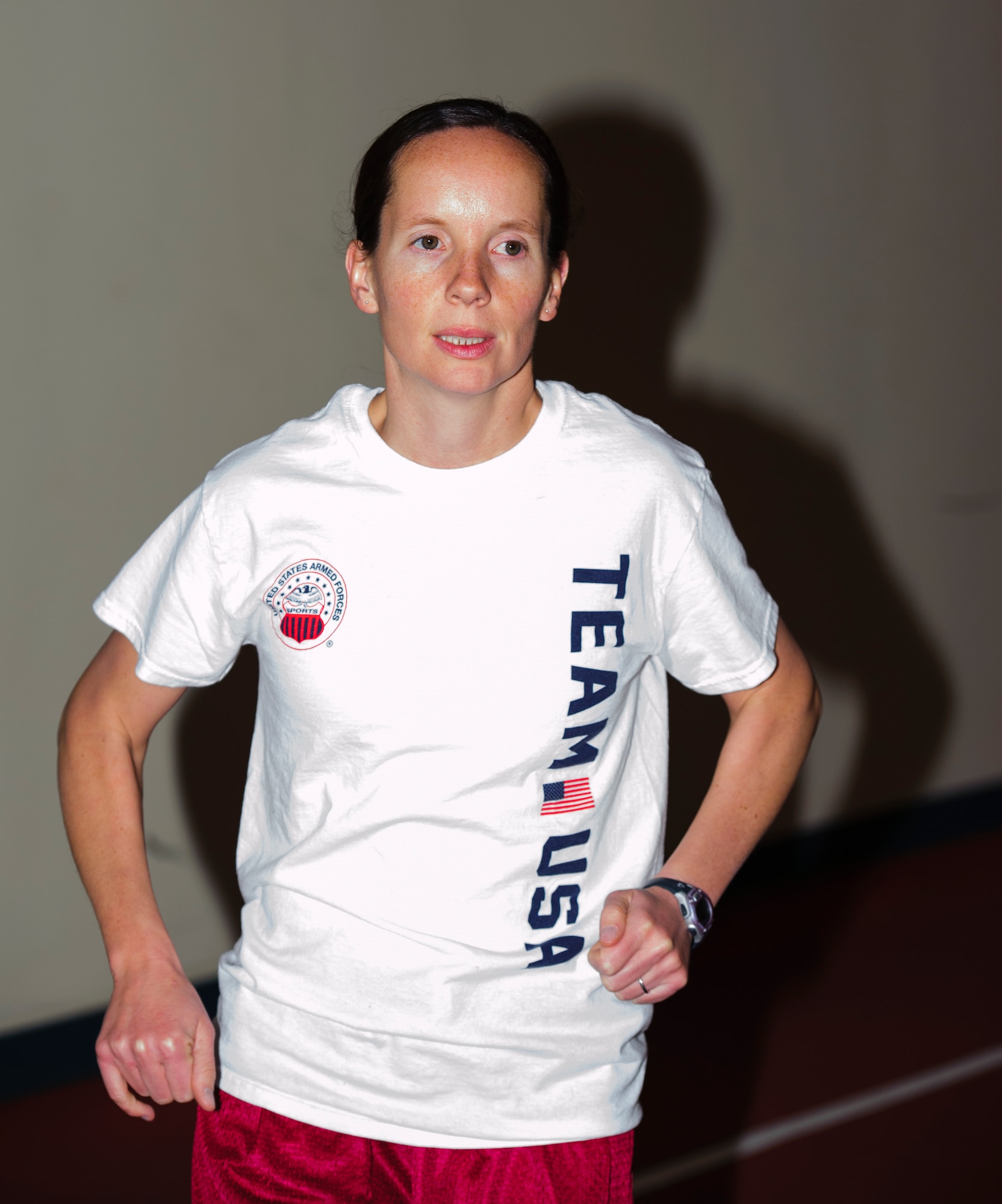 Maj. Elissa Ballas, 8th Medical Operations Squadron physical therapy and health and wellness center flights commander, completes a lap on the base track at Kunsan Air Base Republic of Korea, Dec. 17, 2013. The Air Force named Ballas the 2012 Female Athlete of the Year for her work on and off the track and ability as a marathon runner. (U.S. Air Force photo by Senior Airman Armando A. Schwier-Morales)