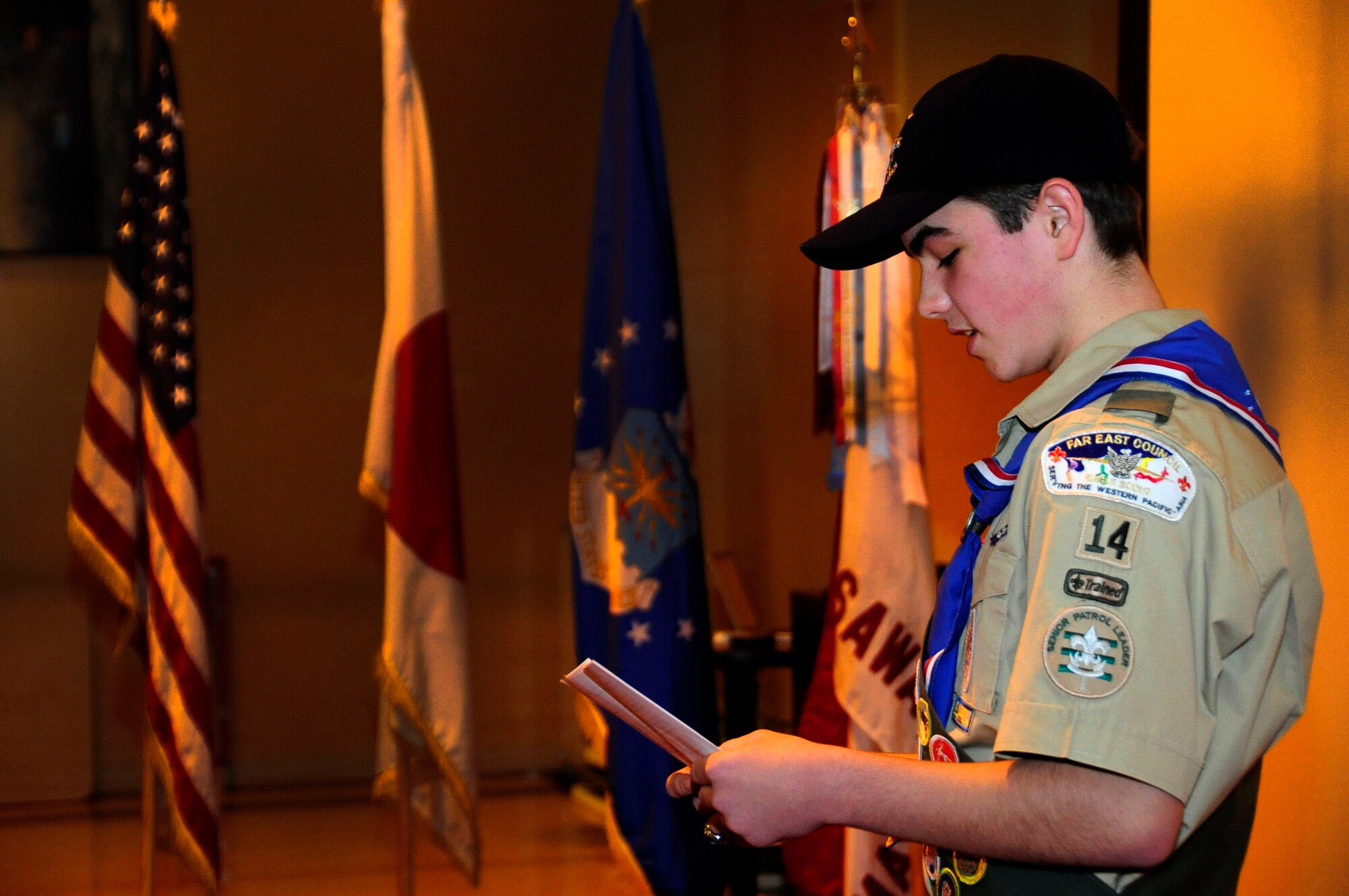 Shawn Singleton reads a letter thanking those who helped him reach his goal of Eagle Scout at Misawa Air Base, Japan, Dec. 15, 2013. Overall Shawn had to earn 21 merit badges including: Citizenship in the Community, Wilderness Survival, and Personal Fitness. In 2012, only seven percent of all Boy Scouts earned the Eagle Scout Rank. (U.S. Air Force photo by Tech. Sgt. April E Quintanilla) 