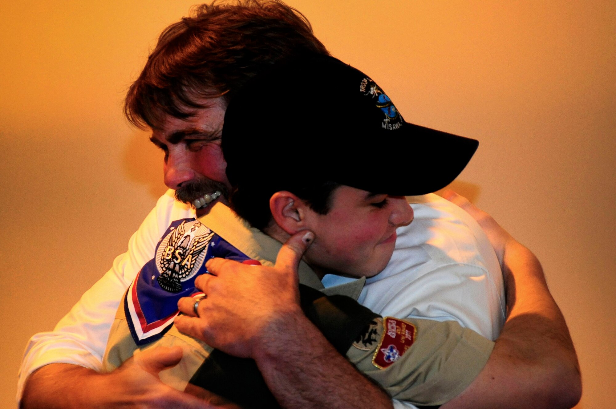 Shawn Singleton, 13, hugs his father Jeff Singleton in thanks for all the support and guidance that was given throughout his journey to reach the rank of Eagle Scout. The national average age to make Eagle Scout is 17 years old. (U.S. Air Force photo by Tech. Sgt. April E Quintanilla)