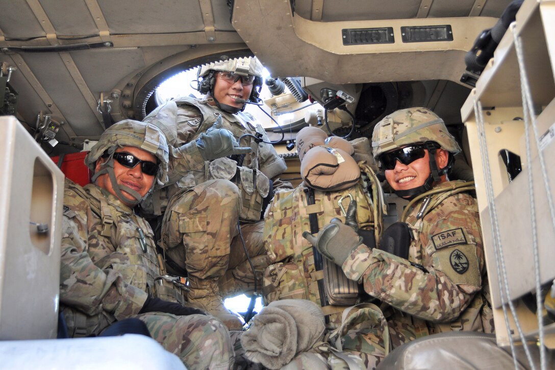 U.S. Army Sgt. David P. Castro, U.S. Army Spcs. Jeffrey Babauta Jr. and Robert M. Castro give the thumbs up before departing Camp Phoenix, Kabul, Afghanistan, Dec. 17, 2013. Castro, Babauta, and Castro are assigned to Guam Army National Guard's Headquarters Company, 1st Battalion, 294th Infantry Regiment, and part of the first group of Guam soldiers that departed Afghanistan as Task Force Guam concludes its historic Operation Enduring Freedom mission.