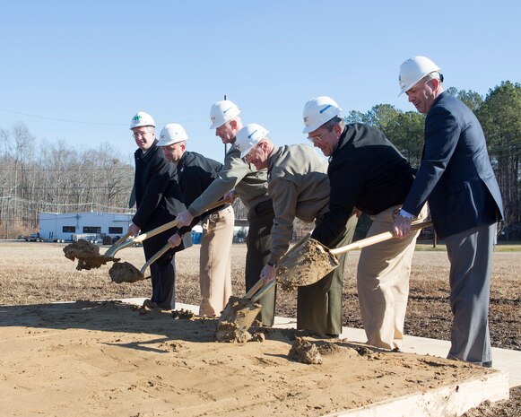 YORKTOWN, Va. (December 18, 2013) -- A ceremonial ground breaking was held Dec. 18 at Naval Weapons Station (WPNSTA) Yorktown to kick off the first phase of a military construction project to build new facilities for Marine Corps Security Force Regiment (MCSFR) at the installation. The new construction includes a regimental headquarters, bachelor enlisted quarters, motor transport facility, supply facility and armory. The project is part of a three-phase consolidation of MCSFR, bringing more than 1,000 additional Marines to WPNSTA Yorktown. Participating in the ground breaking, from left to right, are John Lipp from Archer Western Contractors; Navy Capt. Charlie Willmore, operations officer, Navy Facilities Engineering Command (NAVFAC) Mid-Atlantic; Lt. Gen. Richard Tryon, commander of U.S. Marine Corps Forces Command; Col. James Bright, MCSFR commanding officer; Navy Capt. Lowell Crow, WPNSTA Yorktown commanding officer; and Mark Hourigan from Hourigan Construction. All three phases of the construction project are slated to be completed by 2018/2019. (USMC photo by Steve Kotecki)