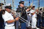 Soldiers from the Florida Army National Guard's 13th Army Band play with members of the Chilean military band during a subject matter exchange on board the Chilean ship Esmeralda at the Port of Miami, Dec. 4, 2013. Both bands played military music from each other's nations during the day-long exchange.