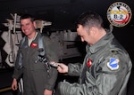 Lt. Col. Jared Kennish, 110th Bomb Squadron Commander, presents Maj. Tim Rezac with his 1000 B-2 flying hour patch, Dec 13, 2013. Only 36 pilots have ever reached 1000 B-2 hours, and just thirteen still actively fly the B-2 Stealth Bomber.