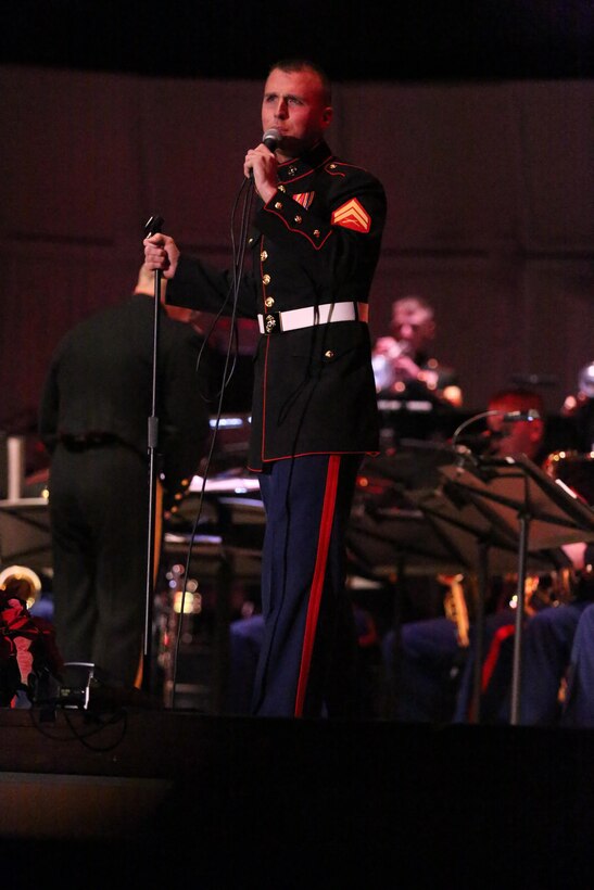 Cpl. Wesley Hayes sings “Jingle Bells” during the 2nd Marine Aircraft Wing Band’s annual Christmas concert, “The Stars and Stripes for Christmas” at Marine Corps Air Station Cherry Point's Two Rivers Theater Dec. 13. Hayes is a musician with the 2nd MAW Band. 