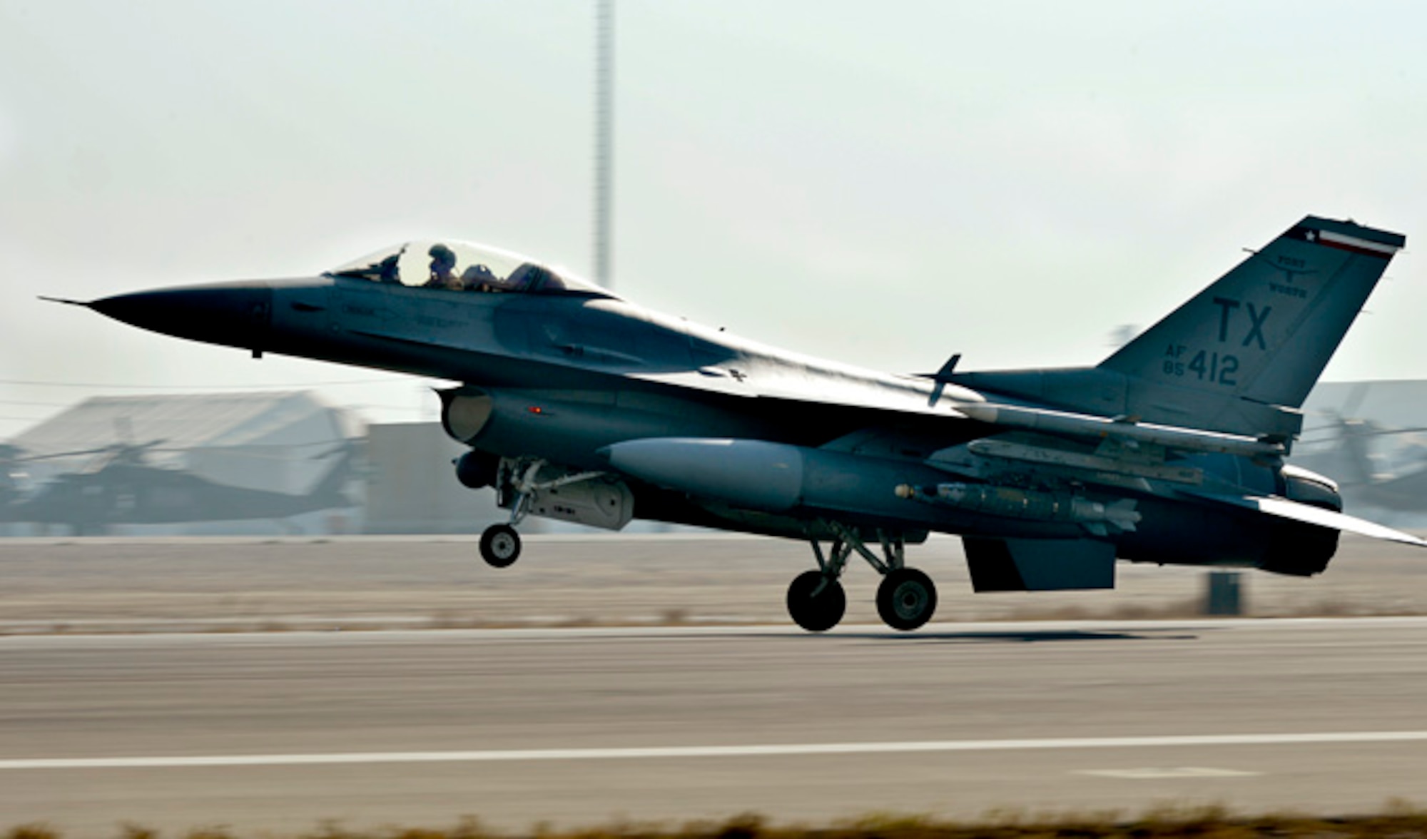 The first F-16 Fighting Falcon arrives Dec. 15, 2013, at Bagram Airfield, Afghanistan. The F-16's transitioned from Kandahar, Afghanistan, to Bagram once the main runway was renovated and extended to meet the demand of the different aircraft. (U.S. Air Force photo/Senior Airman Kayla Newman)