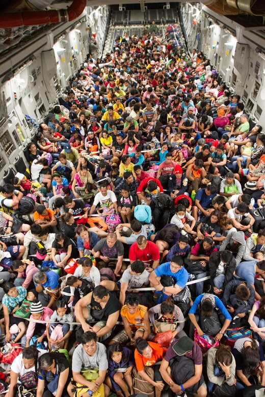 <em>More than 670 displaced Filipinos crammed aboard a C-17 following Super Typhoon Haiyan (U.S. Air Force)</em>