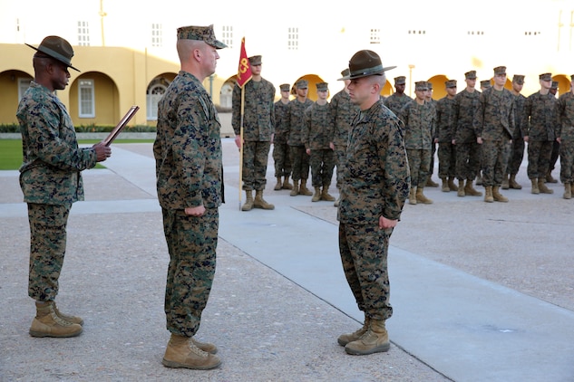 Sgt. Maj. James K. Porterfield, sergeant major of Marine Corps Recruit Depot San Diego and Western Recruiting Region, reads the citation of Gunnery Sgt. Michael H. Wampler, Drill Instructor of the Year, during his meritorious promotion aboard the depot, Nov. 13. Wampler was meritoriously promoted by the Commanding General Brig. Gen. James W. Bierman, MCRD WRR.