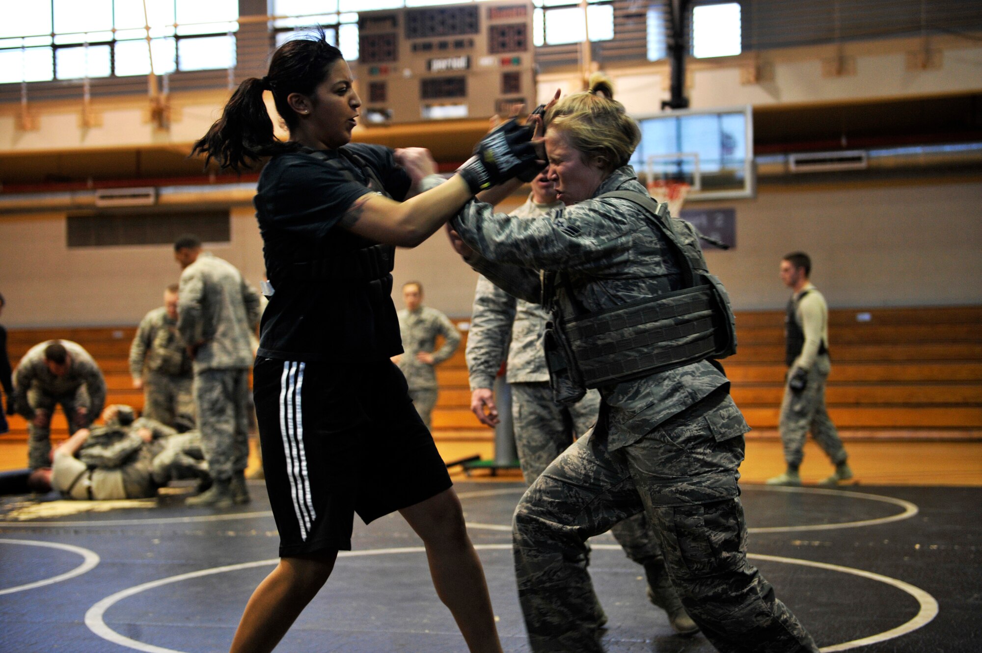 Members of the 51st Security Forces Squadron spar during a Combat Readiness Course at Osan Air Base, Republic of Korea, Dec. 19, 2013.  The training is designed to instill confidence and help the defenders think and react under pressure. (U.S. Air Force photo/Staff Sgt. Emerson Nuñez)