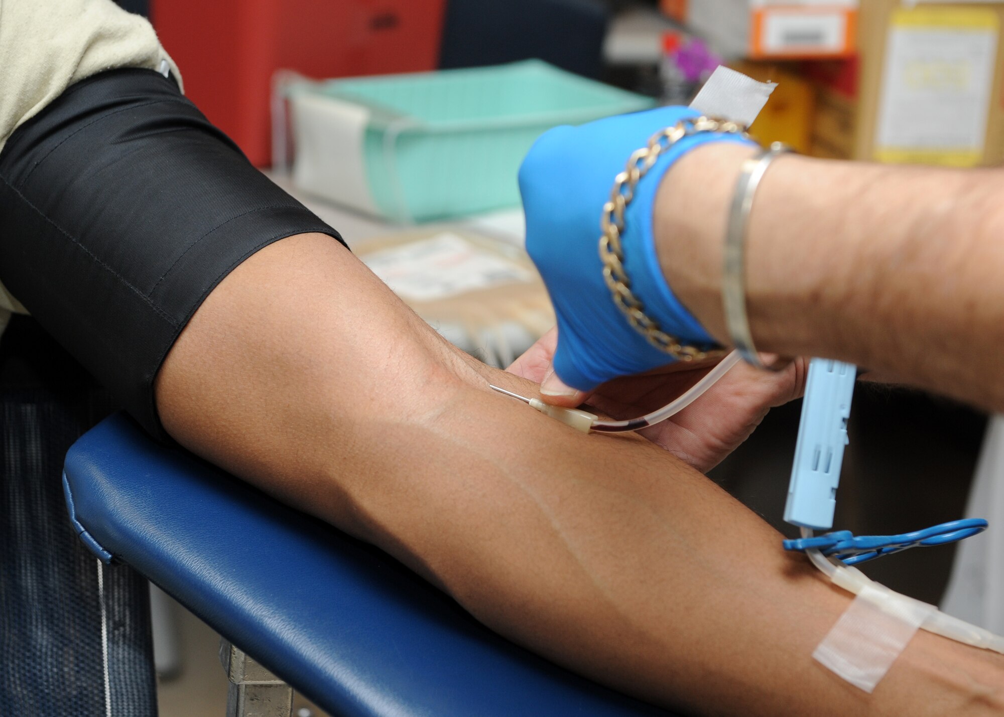 A needle is inserted into the arm of Airman 1st Class Michael William, 2nd Space Warning Squadron, Dec. 19, 2013, at the health and wellness center on Buckley Air Force Base, Colo. According to the American Red Cross, every two seconds someone in the U.S. needs blood. (U.S. Air Force photo by Senior Airman Marcy Copeland/Released)