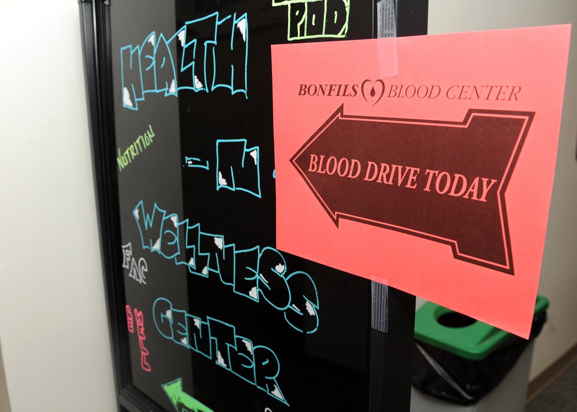 A sign points the way to the Bonfils Blood Center Blood Drive Dec. 19, 2013, at the health and wellness center on Buckley Air Force Base, Colo. According to the American Red Cross, more than 41,000 blood donations are needed every day. (U.S. Air Force photo by Senior Airman Marcy Copeland/Released)