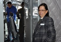 Donna Lea, 916th Air Refueling Wing public affairs specialist, pauses while assisting media representatives covering a news story about the wing's mission. Lea retires in January 2014 after many years of dedicated service to the U.S. Air Force. (USAF photo by SSgt. Alan Abernethy, 916ARW/PA) 