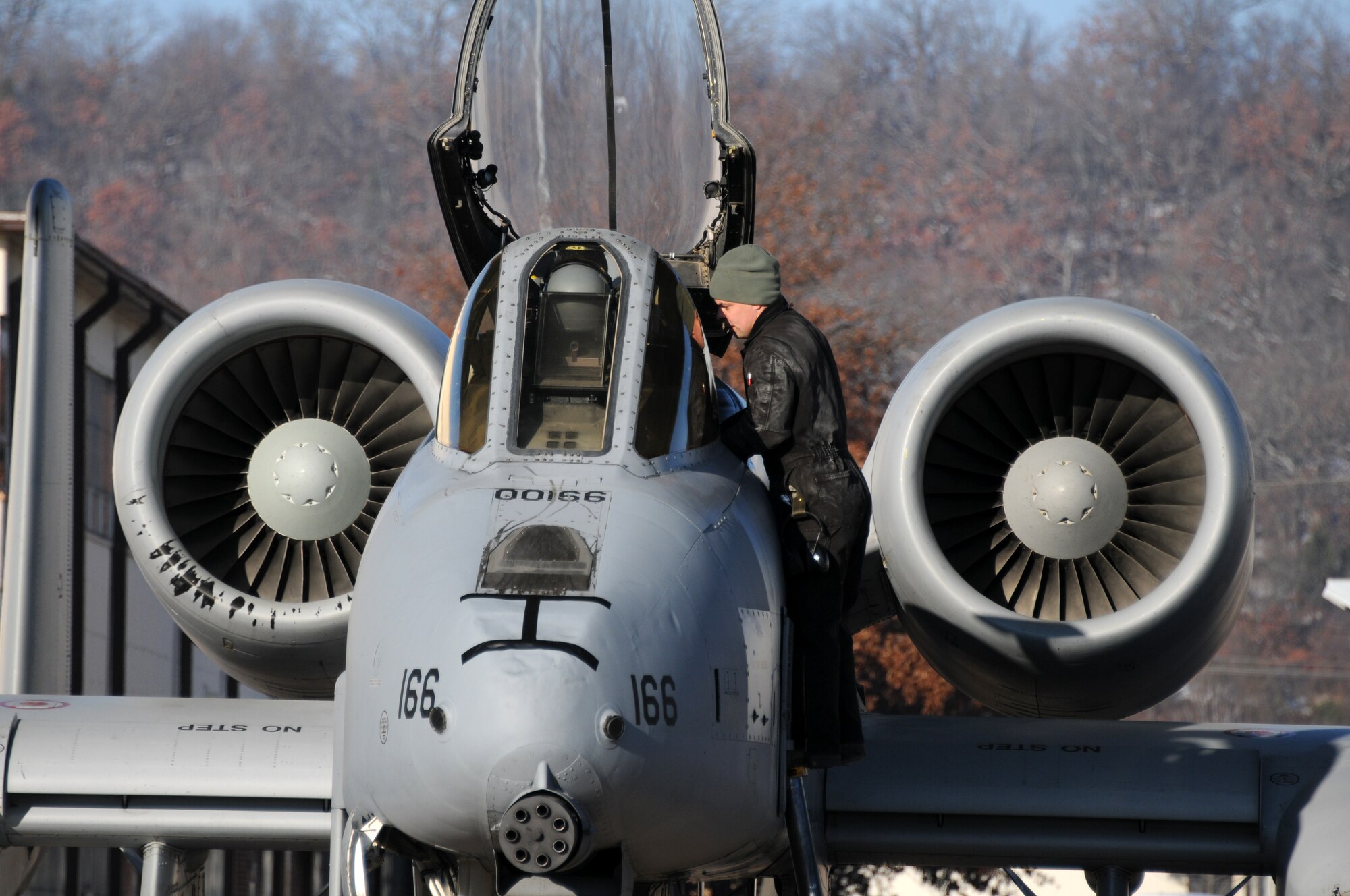 Tech. Sgt. Chris Cooper, a crew chief with the 188th Aircraft Maintenance Squadron, conducts preflight inspections on an A-10C Thunderbolt II (Tail No. 166).  The A-10 was one of two Warthogs from the 188th Fighter Wing's Ebbing Air National Guard Base in Fort Smith, Ark., delivered to Moody Air Force Base, Ga., Dec. 12, 2013, as part of the 188th’s on-going conversion from a fighter mission to remotely piloted aircraft and Intelligence mission, which will include a space-focused targeting squadron. (U.S. Air National Guard photo by Tech Sgt. Josh Lewis/188th Fighter Wing Public Affairs)