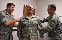 Tech. Sgt. Timothy J. Kelly, 916th Force Support Squadron Non Commissioned officer in charge, receives his promotion in December. (U.S. Air Force photo by Staff Sgt. Terrica Y. Jones, 916th ARW/PA )