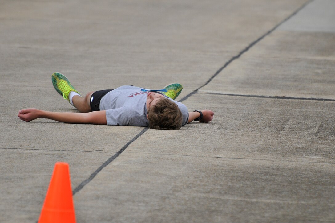 Conner White, a Turkey Trot participant and Men’s Overall Winner, takes a moment to catch his breath after the Turkey Trot. (Photo by Rick Goodfriend)