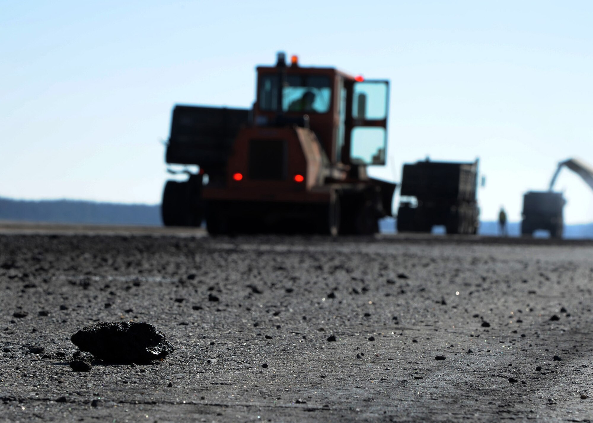 Pieces of crushed asphalt rest on the flightline at Barksdale Air Force Base, La., Dec. 18, 2013. While the flightline is closed for two weeks, 18,000 feet of asphalt will be torn-up and replaced. (U.S. Air Force photo/Senior Airman Joseph A. Pagán Jr.) 
