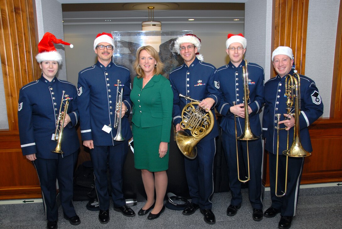 Blue 82 pauses spreading musical cheer in the Pentagon to take a photo with the newly confirmed Secretary Of The Air Force, Deborah Lee James. (photo courtesy U.S. Navy)