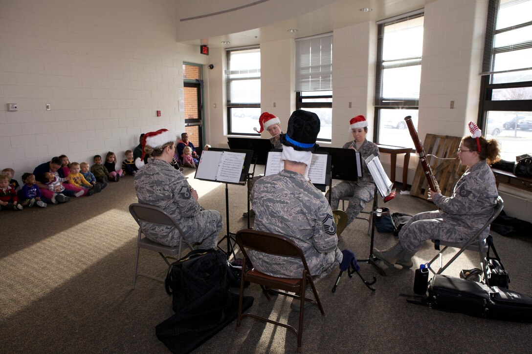 The USAF Band's Woodwind Quintet provided lively holiday music for the children at CDC II on Joint Base Anacostia-Bolling on Dec. 19. This performance is part of the Band's 30-concert holiday schedule this year. (U.S. Air Force photo by Master Sgt. Tara Islas)