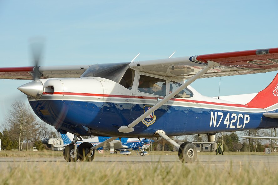 Col. Rick Moore, 436th Airlift Wing commander, taxis a Civil Air Patrol Cessna 182T aircraft toward the Dover Air Force Base, Del., runway on Dec. 19, 2013. Colonel Moore's participation was part of a familiarization flight with CAP, the official United States Air Force Auxiliary, to help him better understand the auxiliaries role in airborne search and rescue. (U.S. Air Force photo/Greg L. Davis)