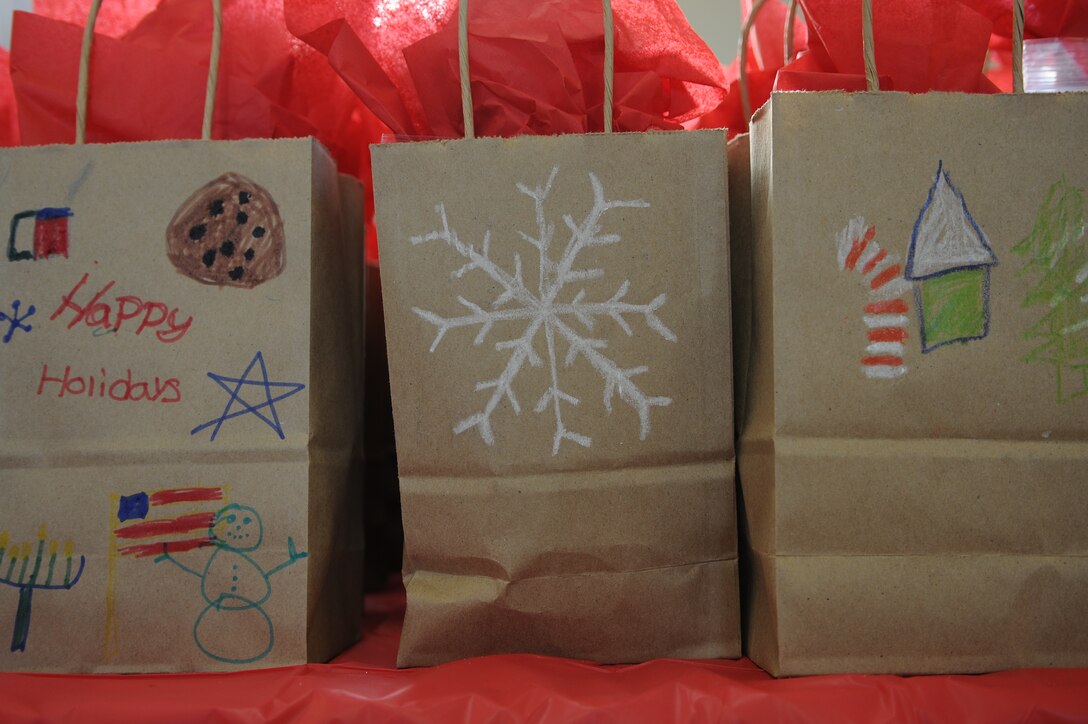 Bags filled with cookies are waiting to be picked up and delivered to the service members of Joint Base Andrews for the annual Cookie Caper Dec. 19. Imagine Andrews’ students and the homeschool group here decorated the bags for the cookies.(U.S. Air Force photo/Airman 1st Class Ryan J. Sonnier)