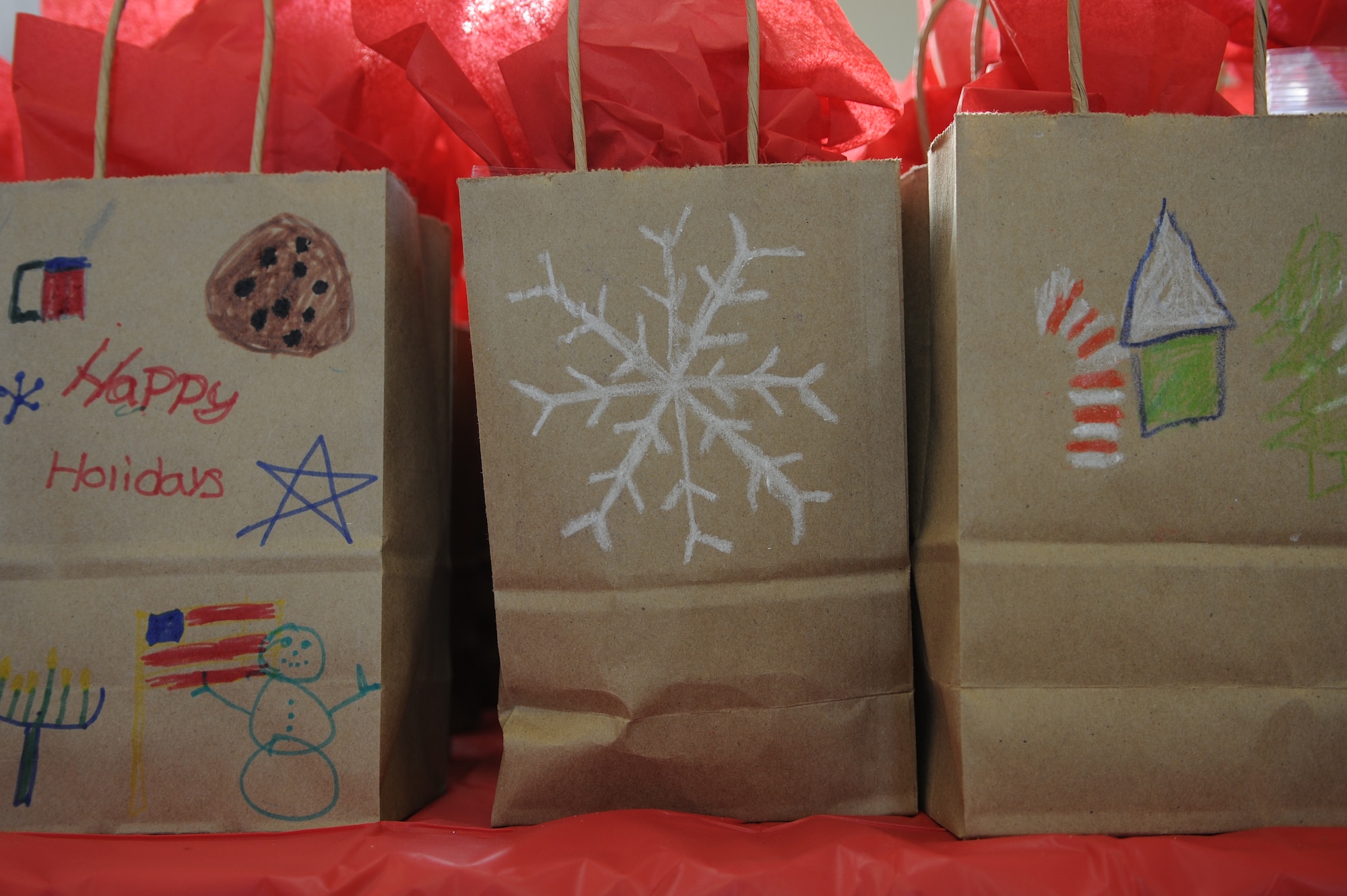 Bags filled with cookies are waiting to be picked up and delivered to the service members of Joint Base Andrews for the annual Cookie Caper Dec. 19. Imagine Andrews’ students and the homeschool group here decorated the bags for the cookies.(U.S. Air Force photo/Airman 1st Class Ryan J. Sonnier)