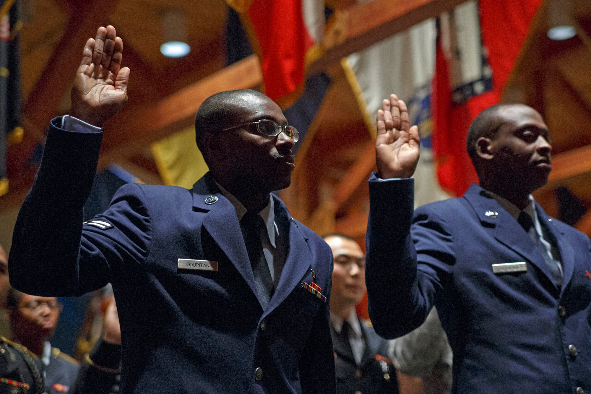 Senior Airman (then Airman 1st Class) Adedapo “Odie” Odupitan, a medical technician with the 446th Aerospace Medicine Squadron, swore in during a naturalization ceremony at McChord Field, Nov. 8.  Odupitan, a Nigerian native, and approximately 30 other foreign service members became U.S. citizens that day. (U.S. Air Force photo by Master Sgt. Jake Chappelle)