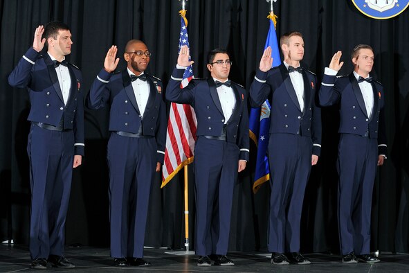 Left to right: Kaleb Jenkins, Adetunji Fiyaso, Christopher De La Torre, Spencer Boone and David Baska are sworn in as second lieutenants during the fall semester graduation in Arnold Hall Wednesday./U.S. Air Force photo by Sarah Chambers.