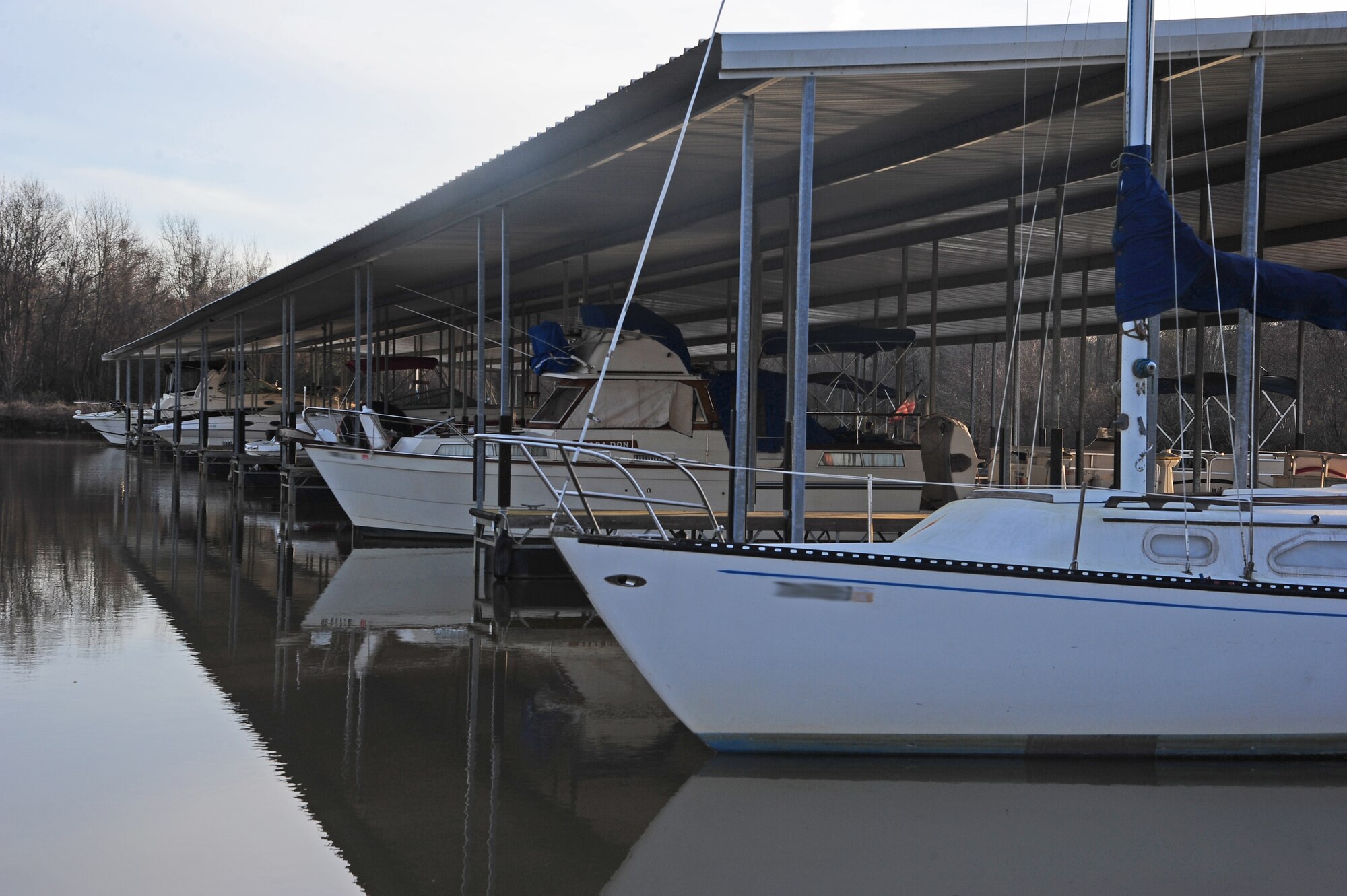 Sunrise falls on a row of boats at a local Columbus, Miss. marina. Most people enjoy boating in the spring or summer time, but boating can be enjoyed year around. Especially with the constantly changing weather around Columbus AFB. (U.S. Air Force Photo/Airman 1st Class Daniel Lile)