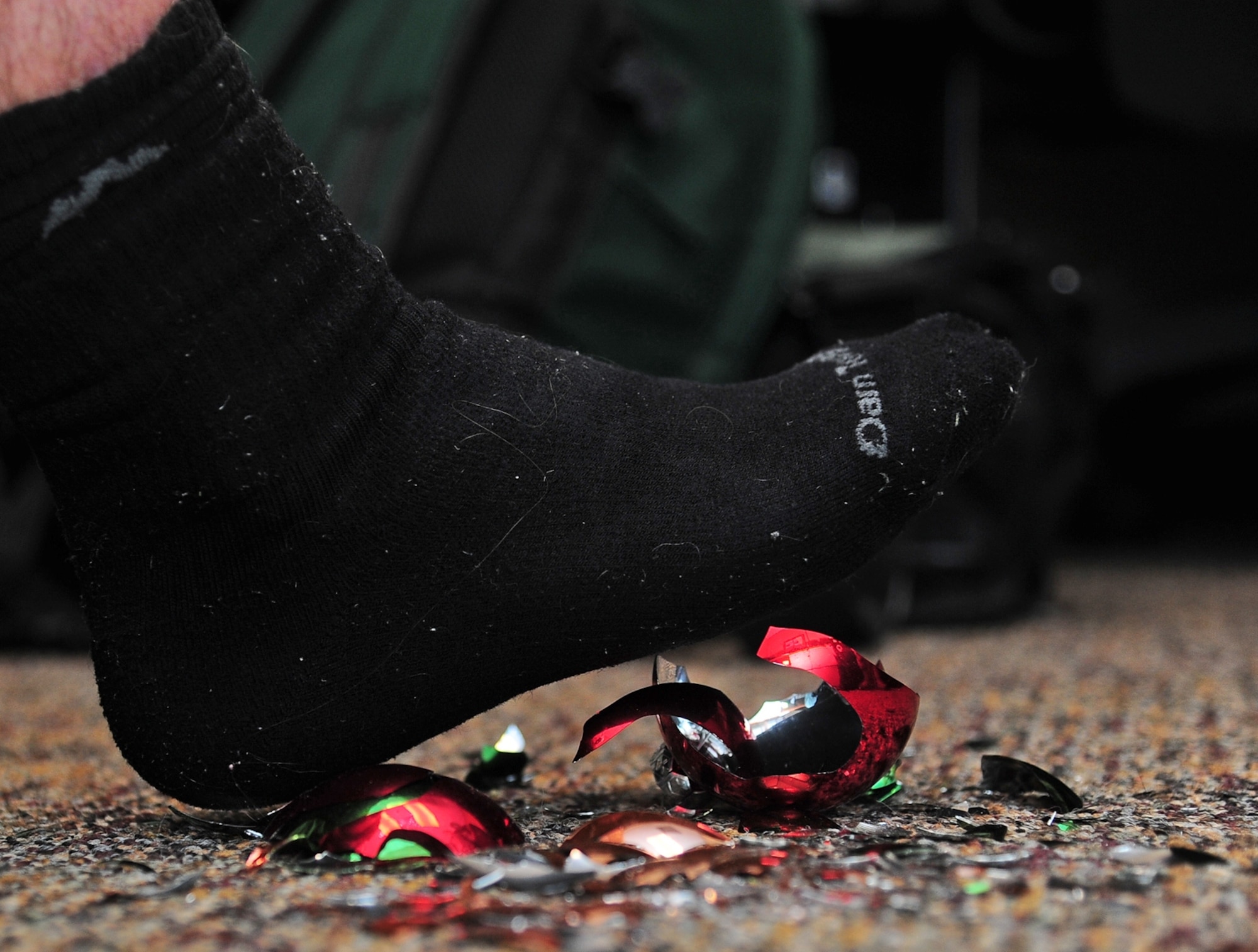 Glass left around by broken ornaments can be a danger to yourself, young children, and pets. Make sure to take care of any fallen ornaments and decorations. (U.S. Air Force photo illustration/Airman 1st Class Stephanie Englar)