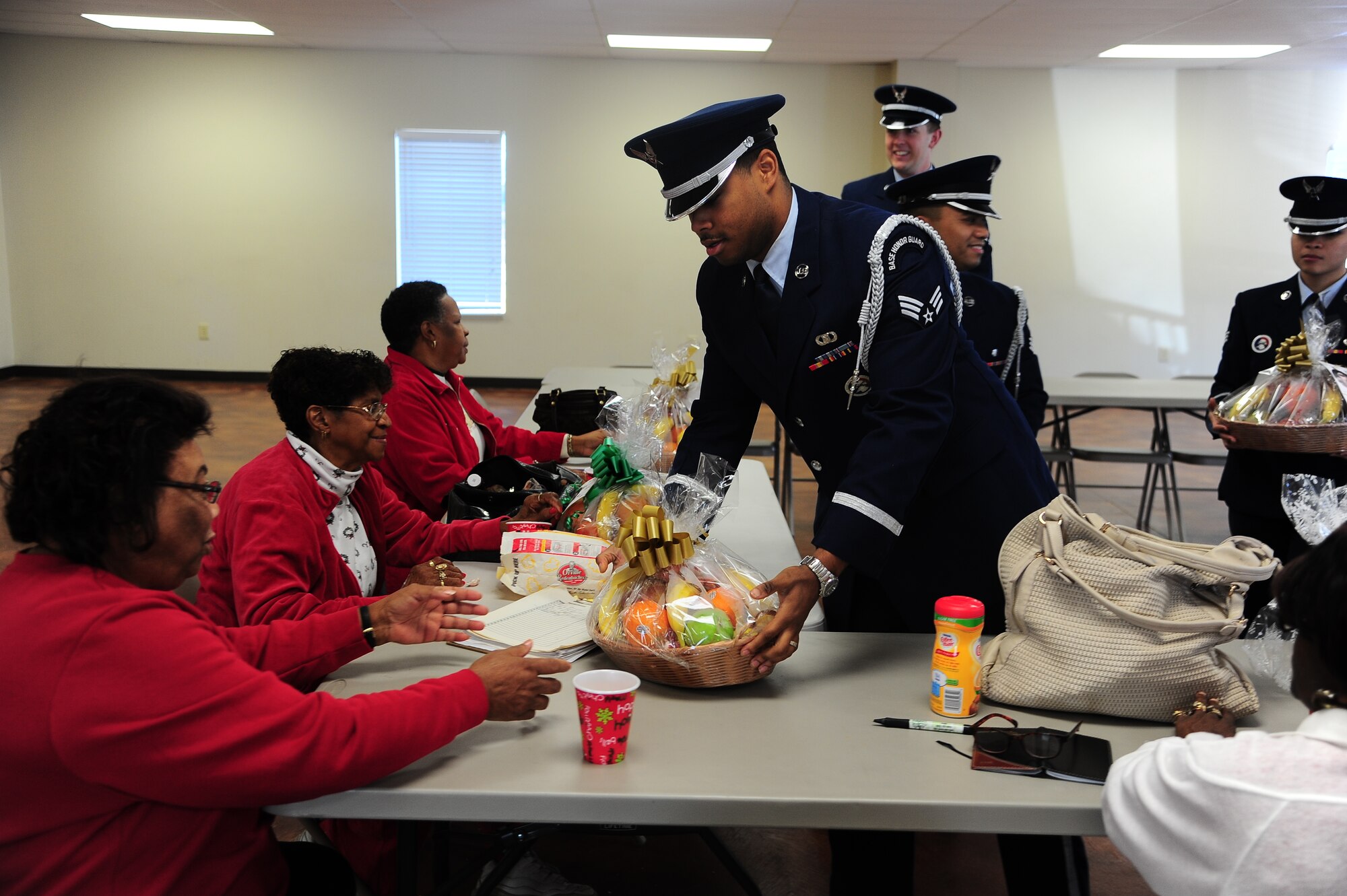 The Columbus Air Force Base Honor Guard delivered fruit baskets to the elderly in Columbus, Miss. Dec. 18 as a volunteer opportunity with the Happy Irby Foundation. The Happy Irby Christmas Fund is a thriving private organization that has benefited thousands of adults and children alike. Yearly, the fund provides clothing and supplies to over 400 children in the local schools and community. In addition, the Happy Fund has delivered over 150 fruit baskets to shut-ins and elderly who would otherwise be alone. In 1996, the Happy Fund became part of the Combined Federal Campaign with 100% of donations used to provide gifts. (U.S. Air Force Photo/Airman 1st Class Daniel Lile)