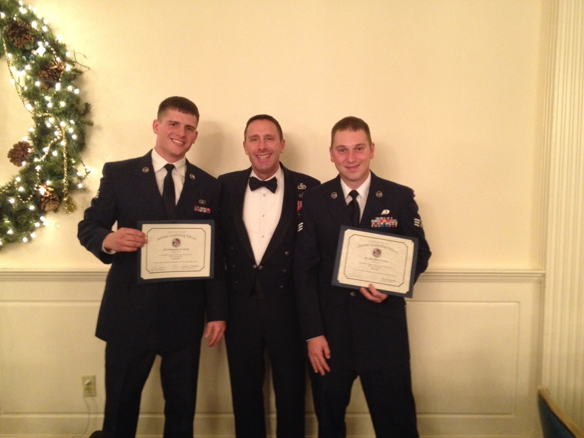 Chief Master Sgt. Vance Kondon, 14th Flying Training Wing Command Chief, poses for a photo with Senior Airman Alexander Gordy, 14th Operations Support Squadron, and Senior Airman Matthew Price, 14th Security Forces Squadron, Dec. 12 at the Airman Leadership School Graduation at Maxwell Air Force Base, Ala. (Courtesy Photo)